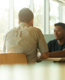 Two people sitting at a table