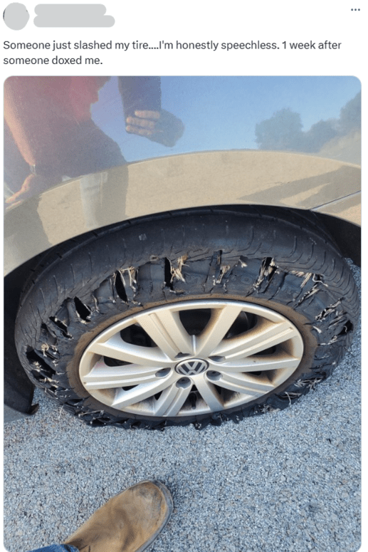 X/twitter post and photo of a slashed tire after getting doxxed