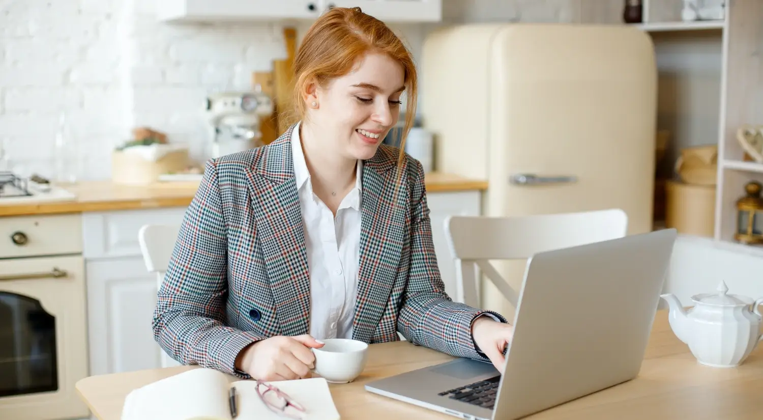 young-red-haired-woman-working-with-laptop-at-home-2022-04-17-05-51-12-utc